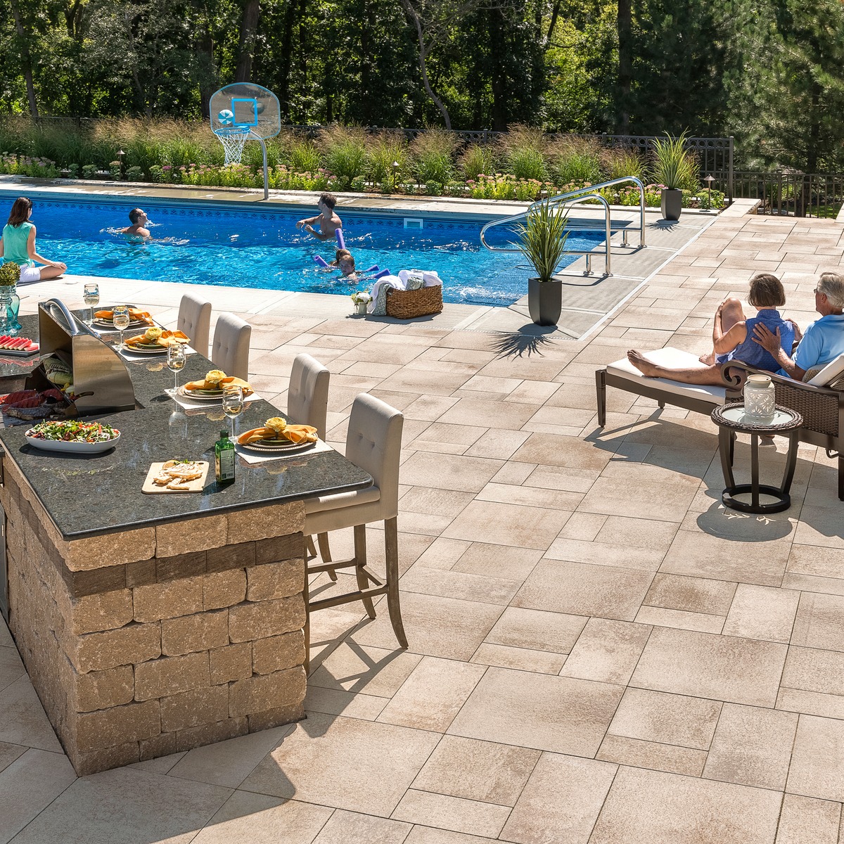 Patio paver pool deck design with bar island