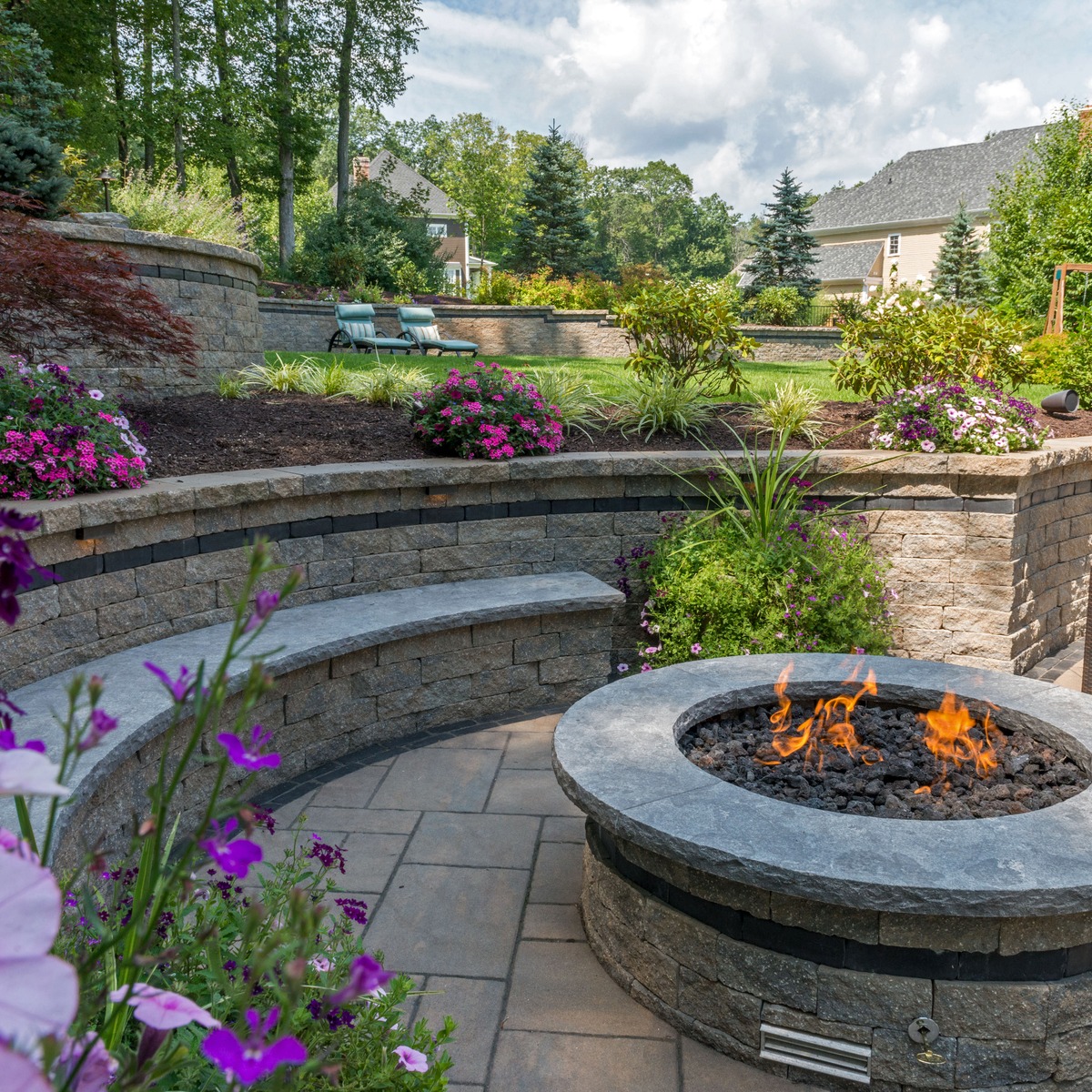 Low seat wall with fire pit centerpiece