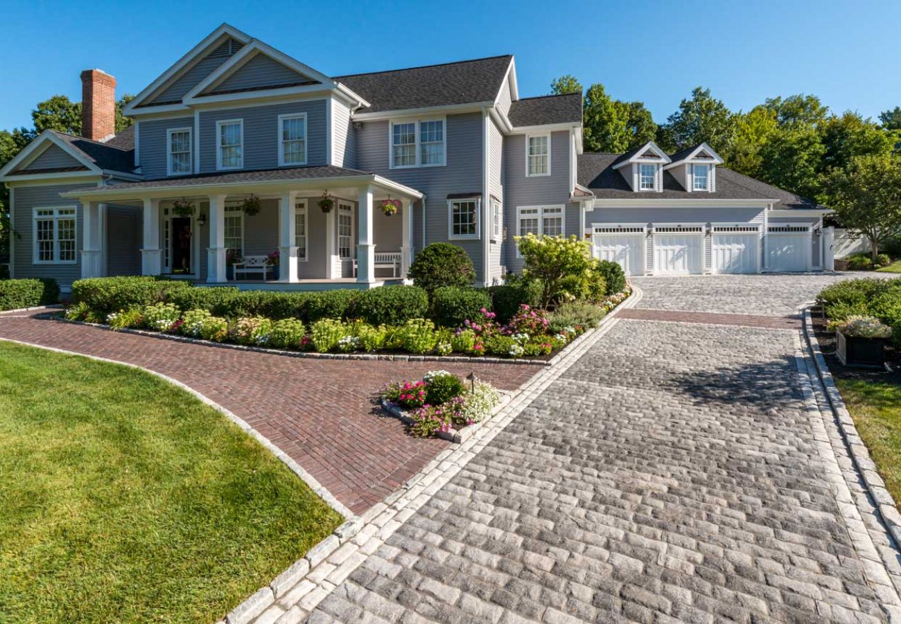 Unilock Paver Driveway attached to Paver Walkway to Front Entrance with Boarders