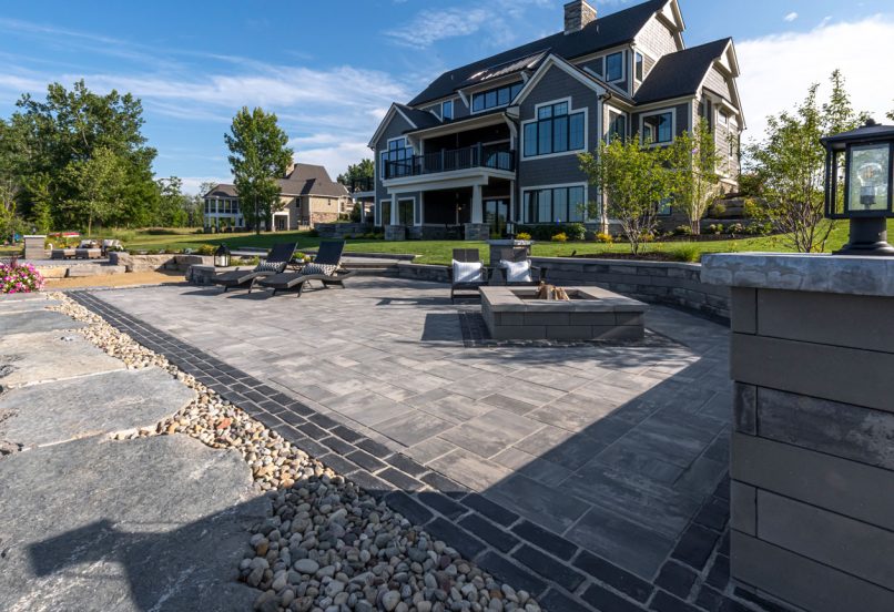 Outdoor Beacon Hill Smooth Patio with Fire Pit and with Boarders and Surrounding Retaining Wall