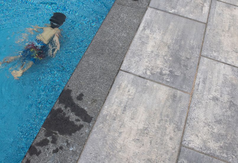 Child in Pool Swimming Underwater