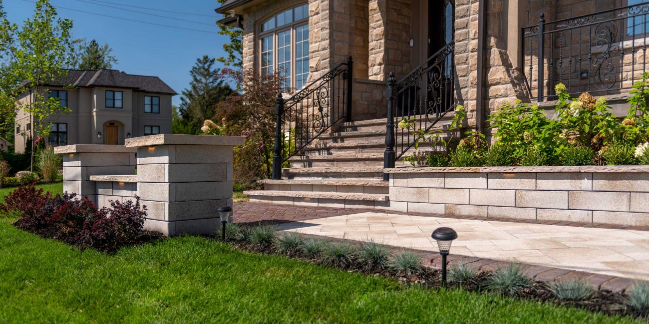 Pillars and Retaining Wall at Front Entrance with Steps and Walkway