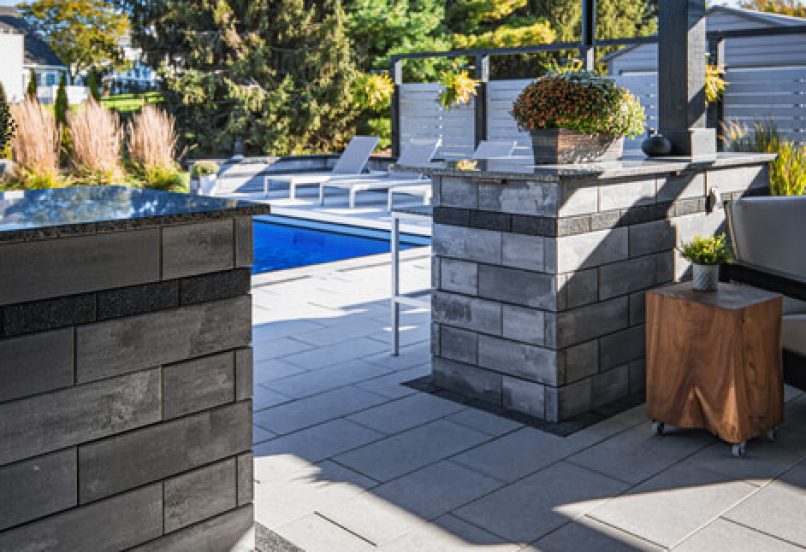 Enclosed Outdoor Patio with Retaining Wall Counters by Pool Deck